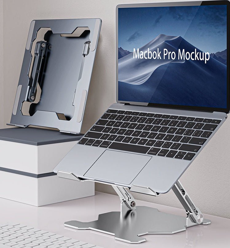 Silver laptop stand used with MacBook on desk.
